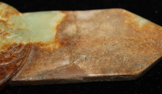 A Chinese yellow and russet jade tablet (gui), Ming dynasty or later, 19.1cm, broken and restored at pointed end, wood stand.